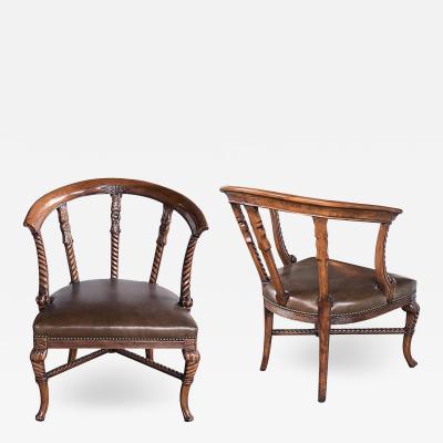 Pair of antique Italian open barrel back armchairs with leather seats
