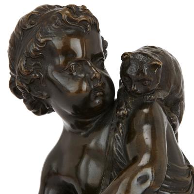 Pair of antique bronze figures of cherubs and animals