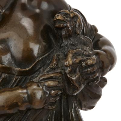 Pair of antique bronze figures of cherubs and animals