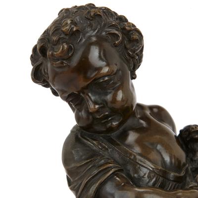 Pair of antique bronze figures of cherubs and animals