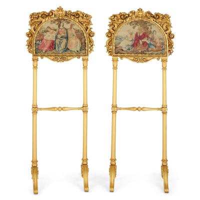 Pair of antique embroidered carved giltwood fire screens