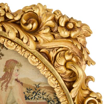 Pair of antique embroidered carved giltwood fire screens