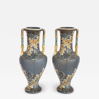 Pair of art nouveau Mettlach pottery vases with incised markings to underside