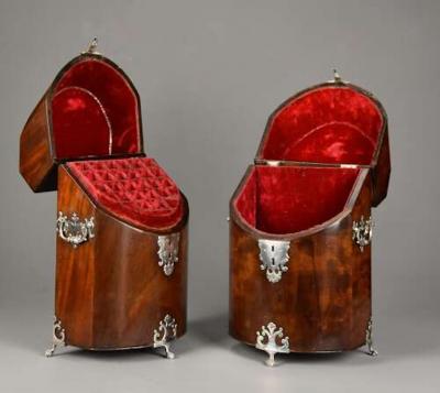 Pair of bow front mahogany cutlery boxes with silver mounts of superb patina