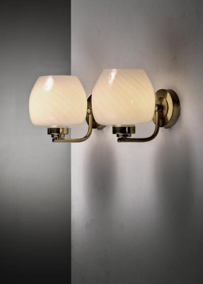 Pair of brass and glass wall lamps