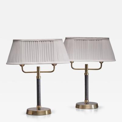 Pair of brass and leather table lamps