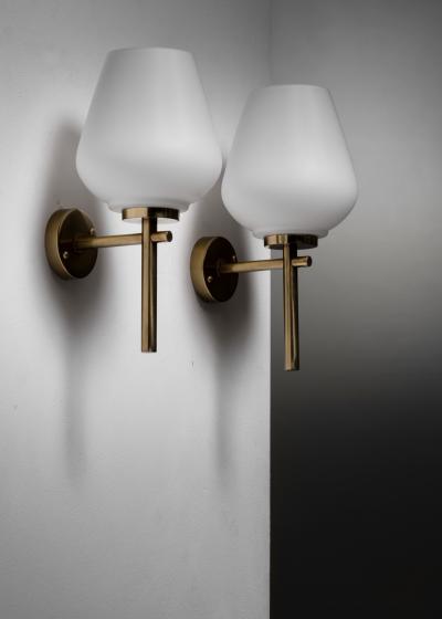 Pair of brass and opaline glass wall lamps