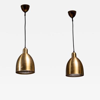 Pair of brass pendant lamps