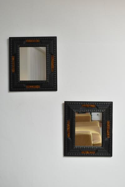 Pair of carved ebonised wood and trompe loeil turshell mirrors XIXth c 