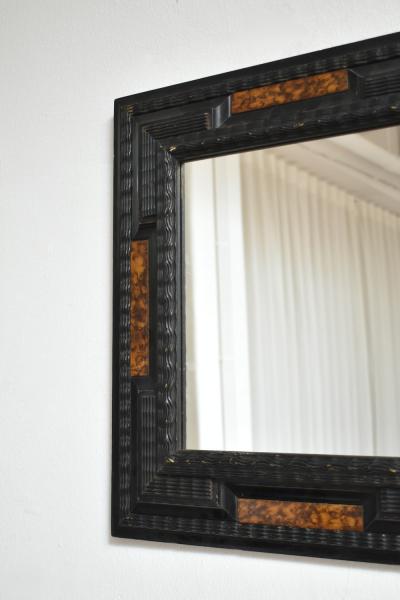 Pair of carved ebonised wood and trompe loeil turshell mirrors XIXth c 