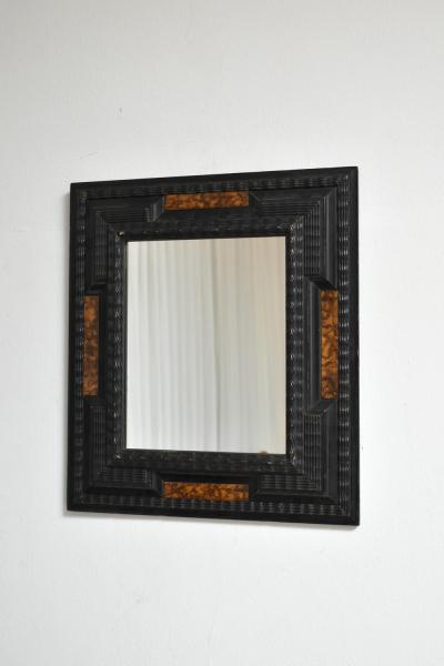 Pair of carved ebonised wood and trompe loeil turshell mirrors XIXth c 