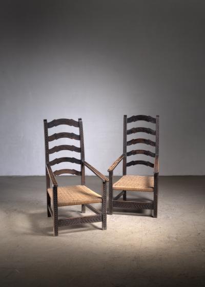 Pair of carved wood armchairs