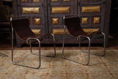 Pair of chrome and leather sling chairs