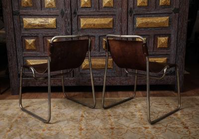 Pair of chrome and leather sling chairs