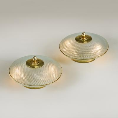 Pair of domed glass table lamps with brass base frame and decorative filial