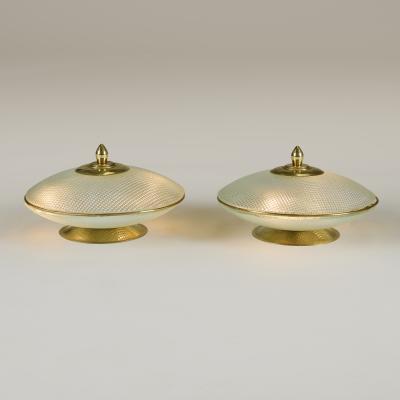 Pair of domed glass table lamps with brass base frame and decorative filial