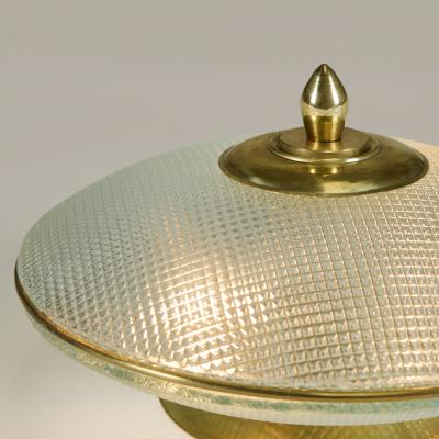 Pair of domed glass table lamps with brass base frame and decorative filial