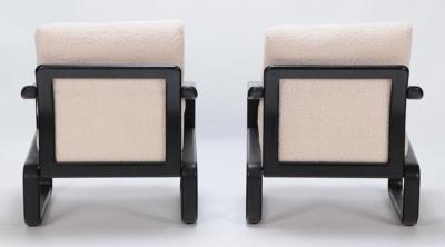 Pair of ebonized French open armchairs recently upholstered in Boucle fabric 