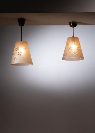 Pair of frosted glass pendant with flower motifs