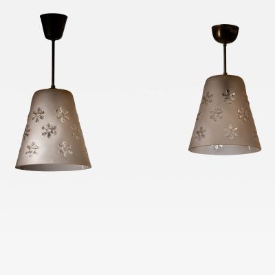 Pair of frosted glass pendant with flower motifs