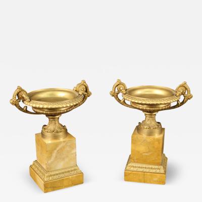 Pair of gilded bronze and yellow marble centerpieces