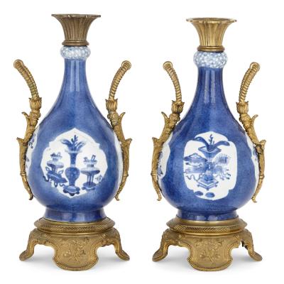 Pair of gilt bronze and Chinese blue and white porcelain vases