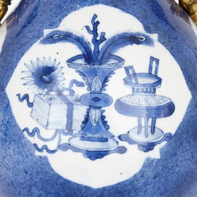Pair of gilt bronze and Chinese blue and white porcelain vases