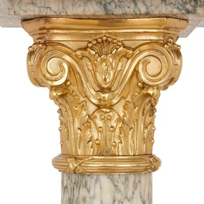 Pair of gilt bronze and marble columns in the Neoclassical style