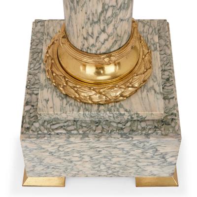 Pair of gilt bronze and marble columns in the Neoclassical style