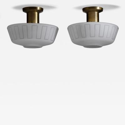 Pair of glass and brass ceiling lamps