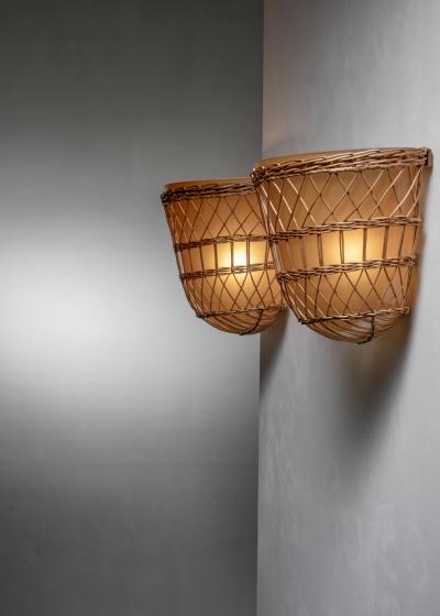 Pair of glass and rattan wall lamps