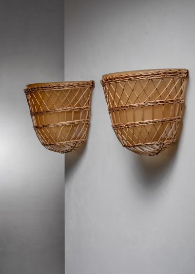 Pair of glass and rattan wall lamps
