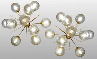 Pair of half sputnik wall lights with globes made by Seguso