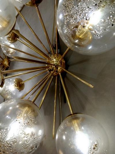 Pair of half sputnik wall lights with globes made by Seguso
