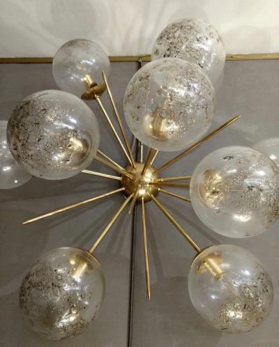 Pair of half sputnik wall lights with globes made by Seguso