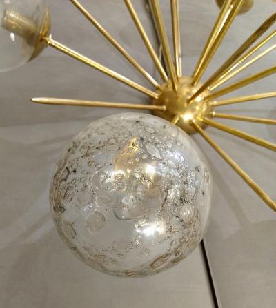 Pair of half sputnik wall lights with globes made by Seguso