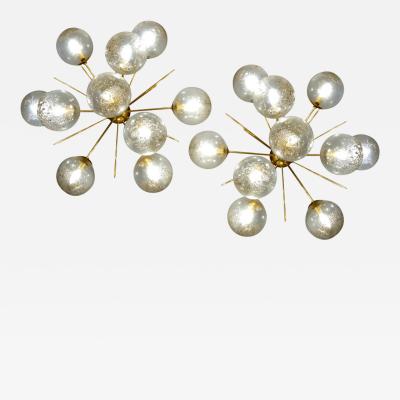 Pair of half sputnik wall lights with globes made by Seguso