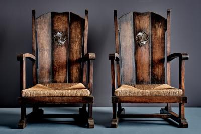 Pair of high Back Armchairs with carved Details and Rush Seats