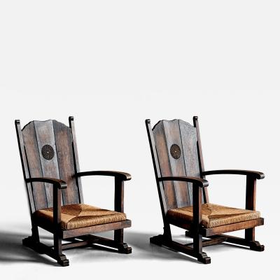 Pair of high Back Armchairs with carved Details and Rush Seats