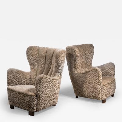 Pair of high wingback lounge chairs Denmark 1940s