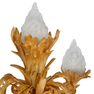 Pair of large Louis XVI style gilt and patinated bronze cherub candelabra