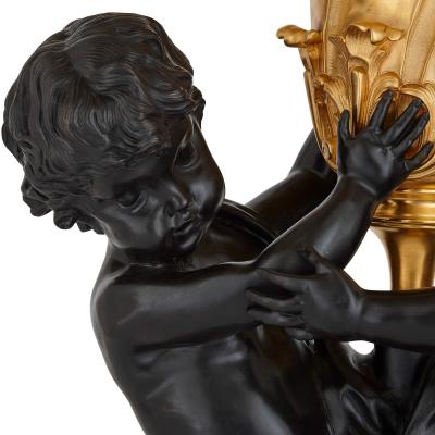 Pair of large Louis XVI style gilt and patinated bronze cherub candelabra