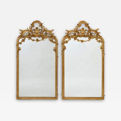 Pair of large Rococo revival giltwood mirrors