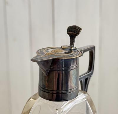 Pair of lidded carafes circa 1910