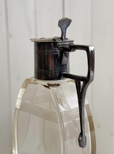 Pair of lidded carafes circa 1910