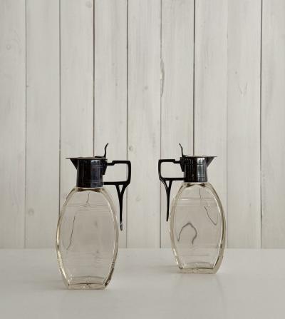 Pair of lidded carafes circa 1910