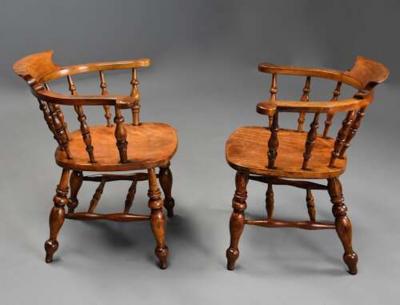 Pair of mid 19th century birch smokers bow Windsor or Captain s chairs