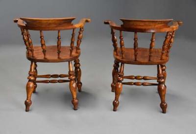 Pair of mid 19th century birch smokers bow Windsor or Captain s chairs