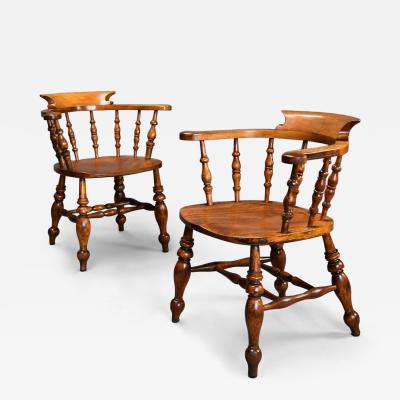 Pair of mid 19th century birch smokers bow Windsor or Captain s chairs