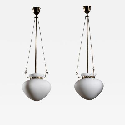 Pair of opaline glass and brass pendants